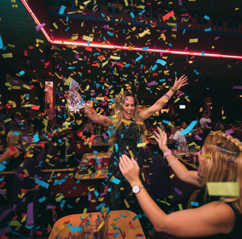 woman having fun at bonkers bingo party - Mecca Bingo