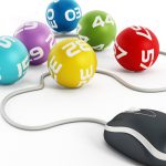Internet lottery concept with computer mouse connected to lottery balls
