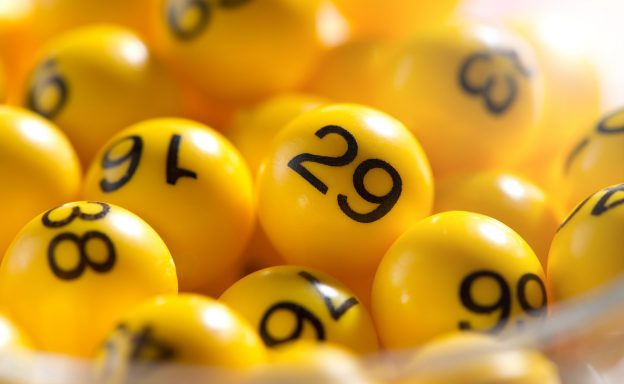Background of yellow balls with bingo numbers used to randomly select lucky numbers during a bingo game